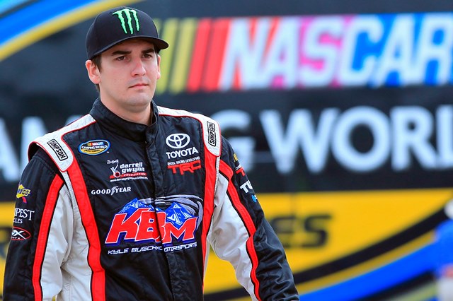 BOWMANVILLE, ON - AUGUST 30: Joey Coulter, driver of the #18 Monster Energy Toyota, stands in the garage area prior to practice for the NASCAR Camping World Truck Series Chevrolet Silverado 250 at Canadian Tire Motorsport Park on August 30, 2013 in Bowmanville, Canada. (Photo by Geoff Burke/NASCAR via Getty Images)
